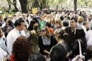 People gather on Paseo de la Reforma avenue, after they evacuated from the buildings after an earthquake in Mexico City