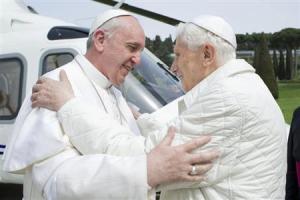 Pope Francis embraces Pope Emeritus Benedict XVI as he arrives at Castel Gandolfo summer residence