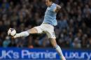 Manchester City's Edin Dzeko stretches for a ball during his team's 4-0 win against Aston Villa in their English Premier League soccer match at the Etihad Stadium, Manchester, England, Wednesday May 7, 2014. (AP Photo/Jon Super)