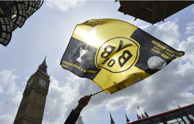 A Borussia Dortmund supporter waves a flag in central London