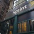People walk past a Sprint store in New York