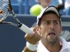 Novak Djokovic, from Serbia, hits a forehand during the men's final against Andy Murray, of Britain, at the Western & Southern Open tennis tournament, Sunday, Aug. 21, 2011, in Mason, Ohio. Djokovic retired with a shoulder injury and Murray leading 6-4, 3-0. (AP Photo/Al Behrman)