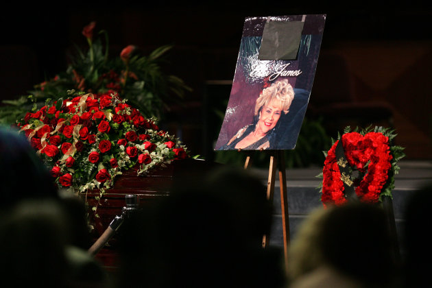 Singer Etta James's picture is seen next to her casket during a funeral, Saturday, Jan. 28, 2012, at Greater Bethany Community Church City of Refuge in Gardena, Calif. James died last Friday at age 73 after battling leukemia and other ailments, including dementia. She was most famous for her classic "At Last," but over her decades-long career, she became revered for her passionate singing voice. (AP Photo/Ringo H.W. Chiu)