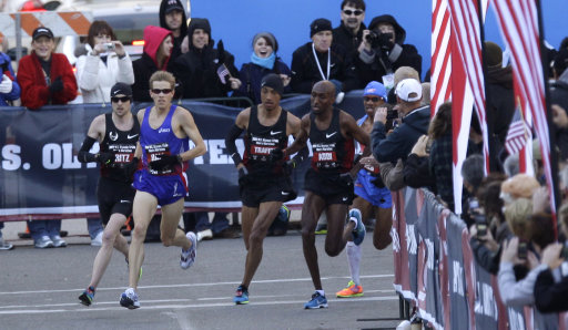 From left to right, Dathan Ritzenhein, Ryan Hall, Mohamed Trafeh, Abdi Abdirahman and Meb Keflezighi run through a turn during the U.S. Olympic Trials Marathon Saturday, Jan. 14, 2012, in Houston. (AP Photo/David J. Phillip)