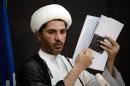 Sheikh Ali Salman -- the leader of the Al-Wefaq Shiite opposition group -- displays a document during a press conference in the village of Zinj, west of Manama, on July 4, 2013