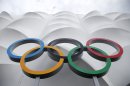 The Olympic rings are displayed outside the basketball arena in the Olympic Park before the start of the 2012 Summer Olympics, Sunday, July 15, 2012, in London. (AP Photo/Jae Hong)