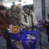 In this Thursday, Jan. 19, 2012 photo, people push their shopping carts at the Kwangbok Area shopping center to buy groceries in Pyongyang, North Korea. (AP Photo/David Guttenfelder)
