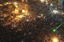 Protesters gather as they chant anti-President Mohamed Mursi slogans during a protest in Tahrir square in Cairo