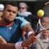 Jo-Wilfried Tsonga of France returns in his fourth round match against Stanislas Wawrinka of Switzerland at the French Open tennis tournament in Roland Garros stadium in Paris, Sunday June 3, 2012. (AP Photo/Michel Euler)