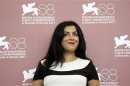 Director Satrapi poses during a photocall of her film "Poulet aux prunes" at the 68th Venice Film Festival