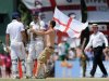 Kevin Pietersen (2L) and Alastair Cook (L) are congratulated by a fan after sealing victory in Colombo