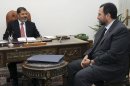 In this Sunday, July 22, 2012 photo released by the Egyptian Presidency, Egyptian President, Mohammed Morsi, left, meets with the minister of Water Resources and Irrigation, Hesham Kandil, at the presidential palace in Cairo, Egypt. On Tuesday, July 24, 2012, Morsi named Hesham Kandil prime minister designate and tasked him with putting together a new Cabinet to replace the current military-appointed one. (AP Photo/Ahmed Mourad, Egyptian Presidency)
