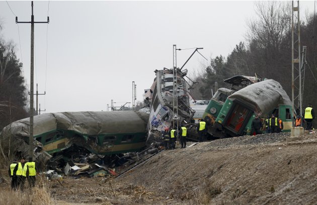 Polish emergency services work at the site of a train crash near the town of Szczechociny