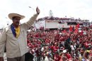 Venezuela's presidential candidate Maduro waves to supporters during a campaign rally in Cojedes