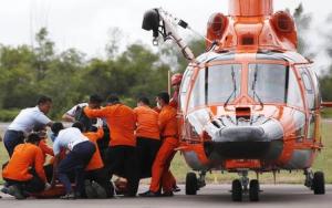Bodies from crashed AirAsia plane arrive in Indonesian city.