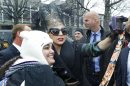 Lady Gaga poses with fans prior to an event at Harvard University in Cambridge, Mass. Wednesday Feb. 29, 2012. Gaga launched her 