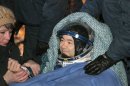 Japanese astronaut Aki Hoshide smiles after landing in a Soyuz capsule outside the town of Arkalyk, Kazakhstan, on Monday, Nov. 19, 2012. Hoshide along with NASA's Sunita Williams, and Russian astronaut Yury Malenchenko touched down in the dark, chilly expanses of central Kazakhstan onboard a Soyuz capsule Monday after a 125-day stay at the International Space Station. (AP Photo/Maxim Shipenkov, Pool)