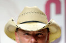 FILE - In this Nov. 9, 2011 file photo, country singer Kenny Chesney poses backstage with the award for music video of the year for 