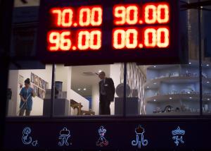 An electronic board shows exchange rates for the Dollar, &hellip;