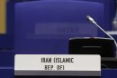 The armchair of Iran's Ambassador to the International Atomic Energy Agency, IAEA, Ali Asghar Soltanieh remains empty at the start of the IAEA board of governors meeting at the International Center, in Vienna, Austria, on Tuesday, March 6, 2012. (AP Photo/Ronald Zak)