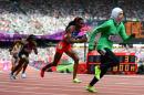 Saudi Arabia's Sarah Attar (R) competes in the women's 800m heats at the London 2012 Olympics on August 8, 2012