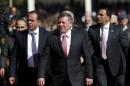 Jordan's King Abdullah (C) leaves after a ceremony to honour war veterans in Amman
