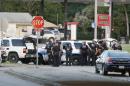 Police block the intersection of Dowdy Ferry Rd and Interstate 45 during a stand off with a gunman barricaded inside a van, Saturday, June 13, 2015, in Hutchins, Texas. The gunman allegedly attacked Dallas Police Headquarters. (AP Photo/Brandon Wade)