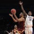 Minnesota's Andre Hollins (1) drives past Washington's Terrence Ross (31) and C.J. Wilcox (23) during overtime in an NIT college basketball tournament semifinal, Tuesday March 27, 2012, in New York. Minnesota won 68-67.(AP Photo/Frank Franklin II)