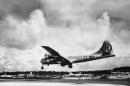 FILE - In this Aug. 6, 1945 file photo, the "Enola Gay" Boeing B-29 Superfortress lands at Tinian, Northern Mariana Islands after the U.S. atomic bombing mission against the Japanese city of Hiroshima. Tom VanKirk says his 93-year-old father, the last surviving member of the Enola Gay crew, died in Stone Mountain, Ga. on Monday, July 28, 2014. (AP Photo/Max Desfor)