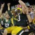 Green Bay Packers' John Kuhn celebrates a touchdown run during the second half of an NFL football game against the New Orleans Saints Thursday, Sept. 8, 2011, in Green Bay, Wis. The Packers won 42-34. (AP Photo/Morry Gash)