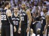 San Antonio Spurs' Tim Duncan (21), Tiago Splitter (22) Manu Ginobili (20) and Kawhi Leonard (2) take a break during a timeout during the second half of Game 1 of the NBA Finals basketball game against the Miami Heat, Thursday, June 6, 2013 in Miami. (AP Photo/Lynne Sladky)