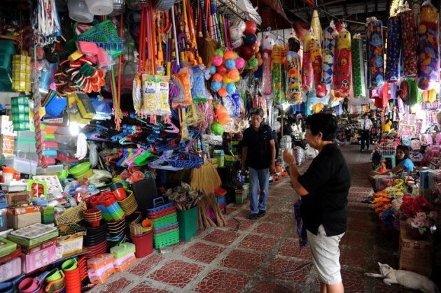 A customer looks at goods at a general merchandise store in Manila on January 4, 2013. The Philippines said Thursday the economy grew a faster-than-expected 6.6 percent in 2012, cementing its status as one of the best performing in Asia