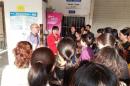 Handout photo of Huang Xingguo talking to workers outside a closed Walmart store in Changde