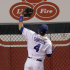 Kansas City Royals left fielder Alex Gordon climbs the fence while chasing a two-run home run hit by Chicago White Sox's Brent Morel during the eighth inning of a baseball game on Friday, Sept. 16, 2011, in Kansas City, Mo. (AP Photo/Charlie Riedel)