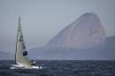 New Zealand's Finn class Andrew Murdoch competes during the first test event for the Rio 2016 Olympic Games at the Guanabara Bay in Rio de Janeiro, Sunday, Aug. 3, 2014. Sugar Loaf Mountain is seen on the background. American sailing officials have hired medical experts to test the water in Guanabara, which has suffered from decades of untreated human waste being poured into the bay. (AP Photo/Felipe Dana)
