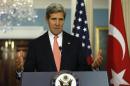 U.S. Secretary of State Kerry answers question as he and Turkish Foreign Minister Davutoglu speak to reporters in Washington