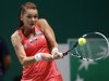 Poland's Radwanska hits a return to Williams of the U.S. during their semifinals WTA tennis championships