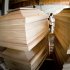 Coffins are stored in a warehouse in Talmaciu, central Romania, on Sept. 16, 2011. Times are so hard in Romania that people joke they cannot afford to die, but in a dark workshop in the mountains of Transylvania, carpenters are churning out cut-price coffins, in a bid to beat the rising costs of death.(AP Photo/Vadim Ghirda)
