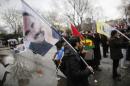 Demonstrators wave flags with the image of imprisoned Kurdish rebel leader Abdullah Ocalan during a rally in Istanbul