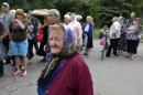 Local citizens lineup to get free food in besieged Slovyansk, eastern Ukraine, Monday