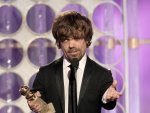 Actor Peter Dinklage accepts his award for best supporting actor in "Game of Thrones" at the 69th Golden Globe Awards in Beverly Hills