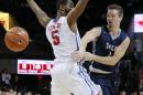 In this Nov. 22, 2015 photo, Yale's Jack Montague, right, passes the ball around SMU's Markus Kennedy during an NCAA college basketball game in Dallas. Montague's attorney said he was expelled from Yale on Feb. 10, 2016, because of a sexual assault allegation. In March Montague, who claims the sexual encounter was consensual, said he plans to sue the school. (AP Photo/Tony Gutierrez, File)