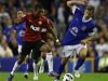 Manchester United's Nani pulls the shirt of Everton's Jelavic during their English Premier League soccer match in Liverpool