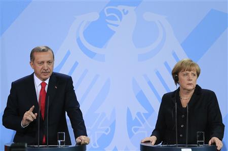 German Chancellor Angela Merkel (R) and Turkish Prime Minister Tayyip Erdogan address the media after talks in Berlin October 31, 2012. REUTERS/Tobias Schwarz