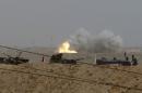 Clashes between Iraqi security forces and Islamic State militants are seen in Tikrit