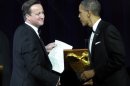 President Barack Obama shakes hands with British Prime Minister David Cameron in between toasts during a State Dinner at the White House in Washington, Wednesday, March 14, 2012. (AP Photo/Susan Walsh)