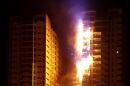 Fire engulfs a tower at a residential cluster in Ajman, in the United Arab Emirates, on March 28, 2016