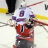 New Jersey Devils goalie Martin Brodeur reacts after being hit by New York Rangers' Brandon Prust during the second period in game 3 of their NHL Eastern Conference Final hockey playoff game in Newark