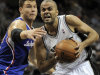 San Antonio Spurs' Tony Parker, right, of France, drives around Los Angeles Clippers' Blake Griffin during the first half of an NBA basketball game, Friday, March 29, 2013, in San Antonio. (AP Photo/Darren Abate)