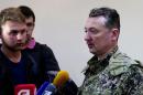 This image taken from Associated Press video shows Igor Strelkov, military commander of pro-Russian militias in Slovyansk talking to journalists in Slovyansk, Ukraine, Sunday, April 27, 2014. Strelkov has been identified as a Russian security services operative by Ukraine's government. In what appeared to be a closely vetted interview to Russian media, Strelkov did not directly deny the accusation, saying the uprising in Ukraine was being carried out by opponents of the "Kiev junta" — language similar in tone to that adopted by the Kremlin leadership. (AP Photo/Associated Press Video)
